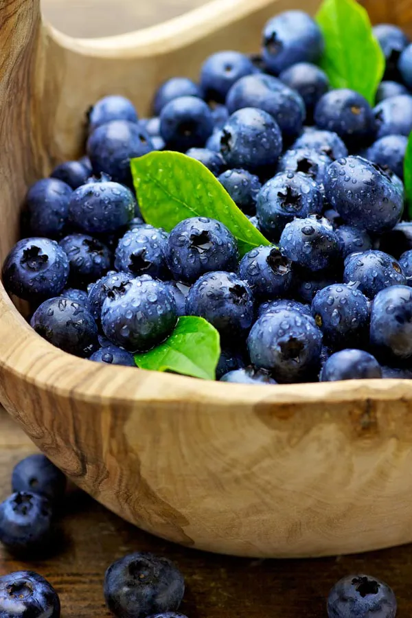 IV-Therapy-Treatment A bowl of refreshing, nourishing blueberries in a wooden bowl, representing IV therapy from Allen Green, M.D. of Center for Optimum Health in Los Angeles.